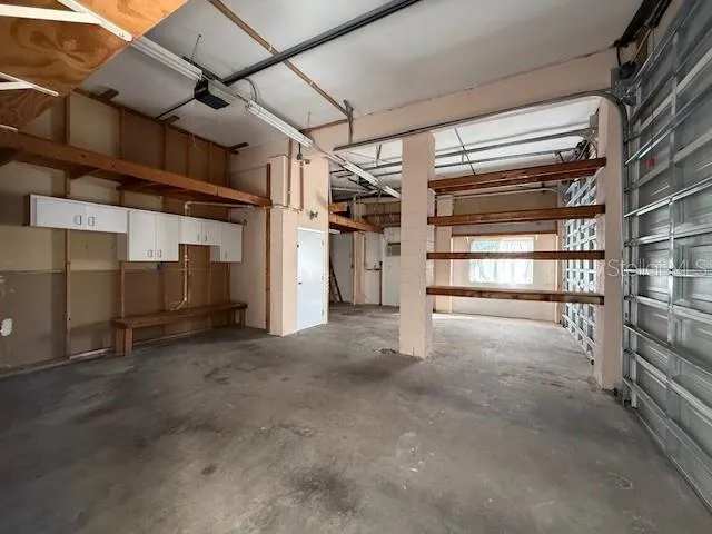 a view of a hallway with wooden floor and entryway