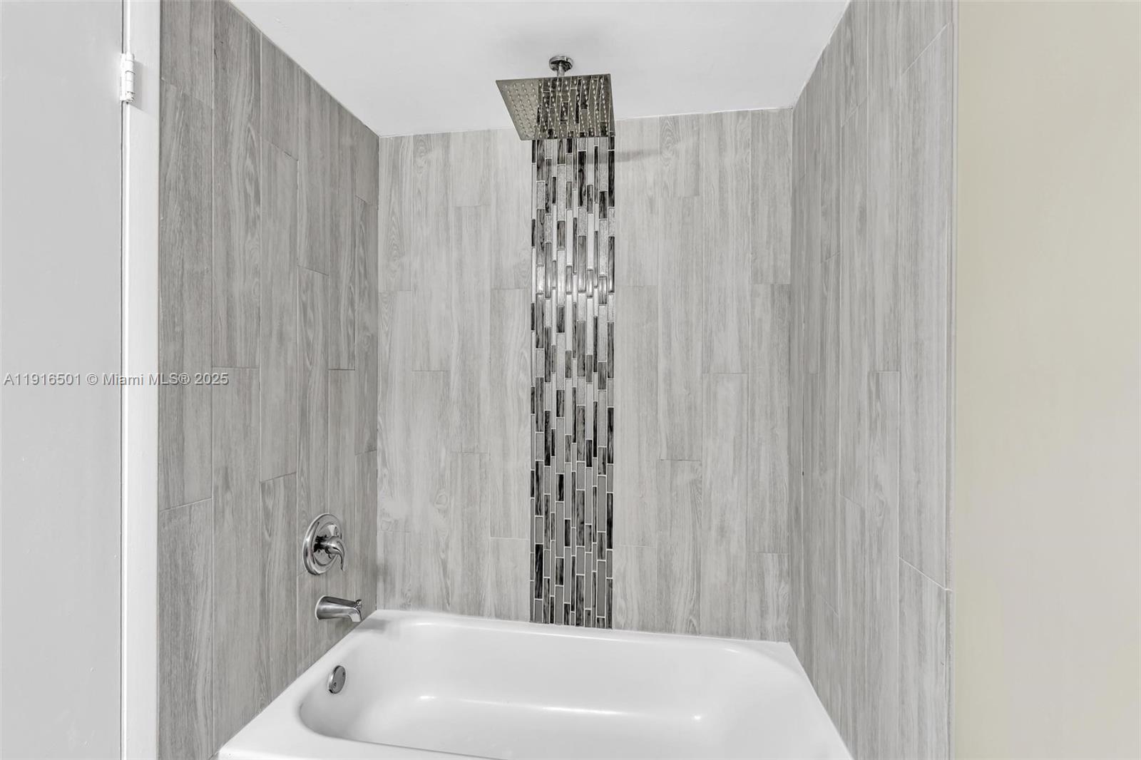 2701 Riverside Drive, Unit 303B Coral Springs, FL 33065 - Photo 11 of 19 a bathroom with a sink a toilet and shower