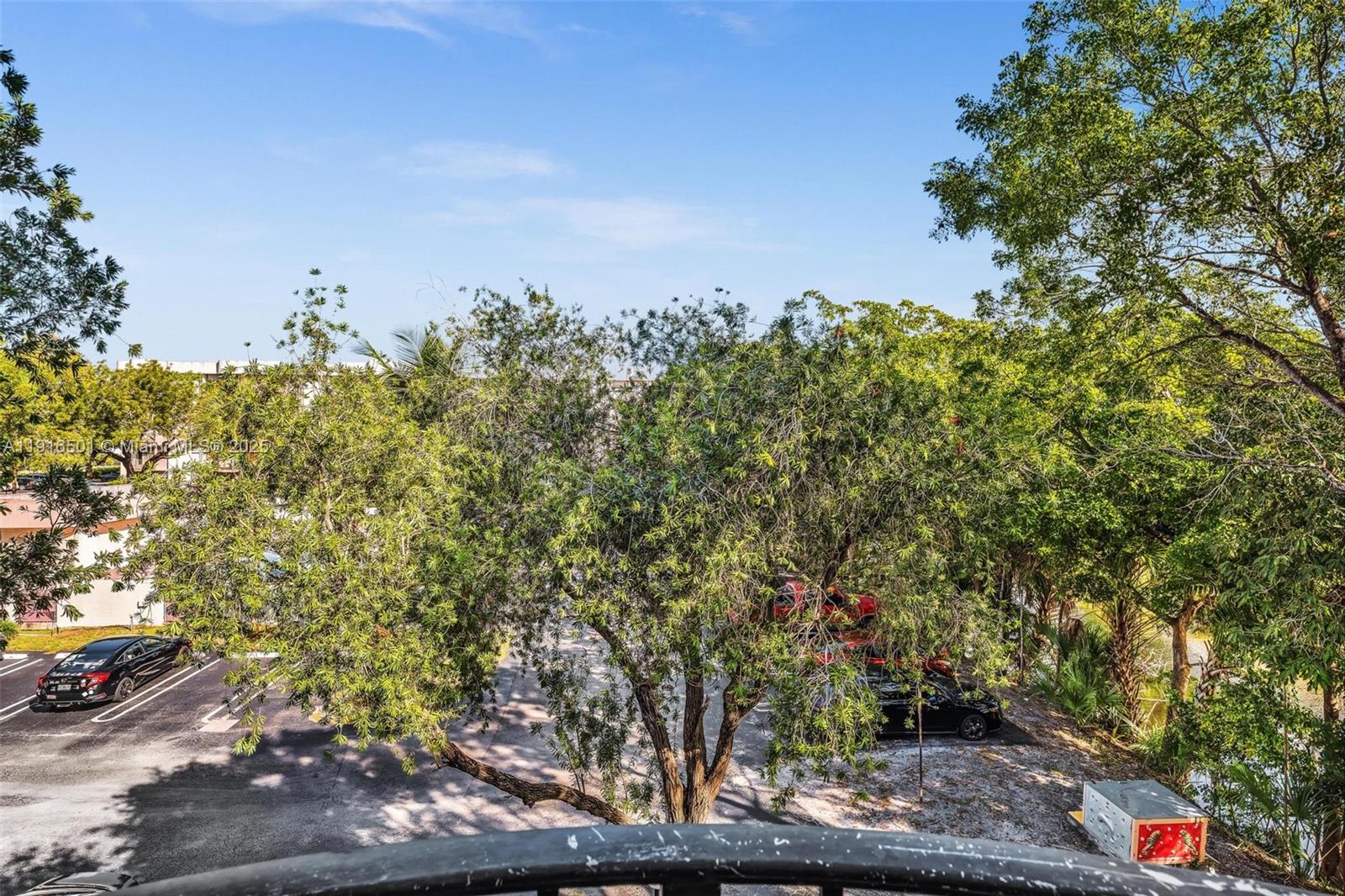 2701 Riverside Drive, Unit 303B Coral Springs, FL 33065 - Photo 12 of 19 a backyard of a house with lots of green space