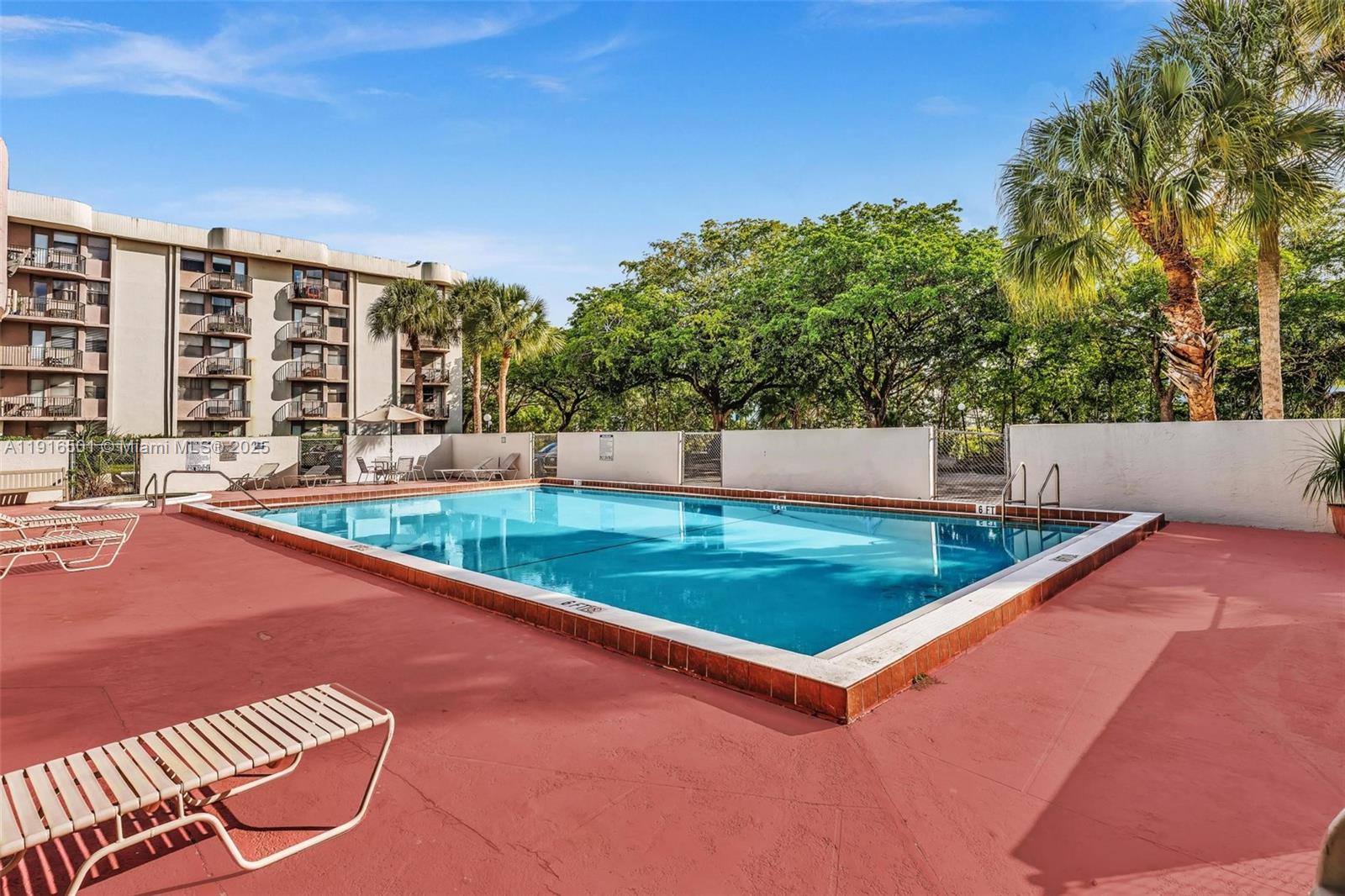 2701 Riverside Drive, Unit 303B Coral Springs, FL 33065 - Photo 15 of 19 a view of a tennis court