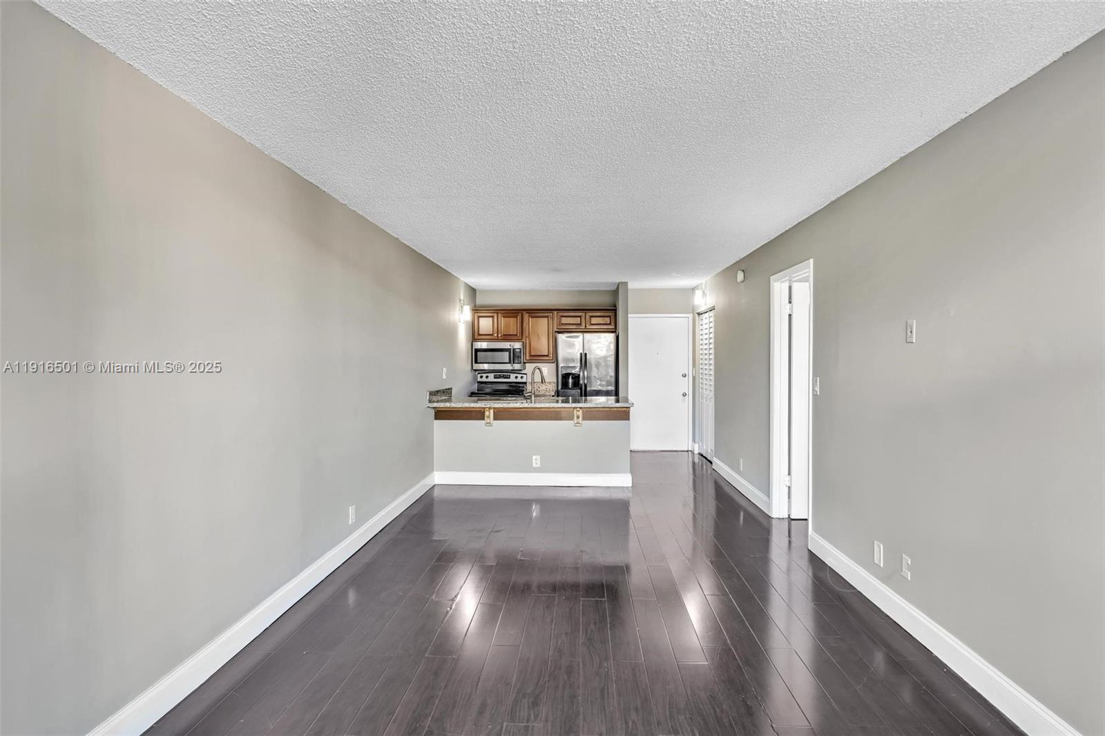 2701 Riverside Drive, Unit 303B Coral Springs, FL 33065 - Photo 4 of 19 a view of a kitchen with a sink and a window