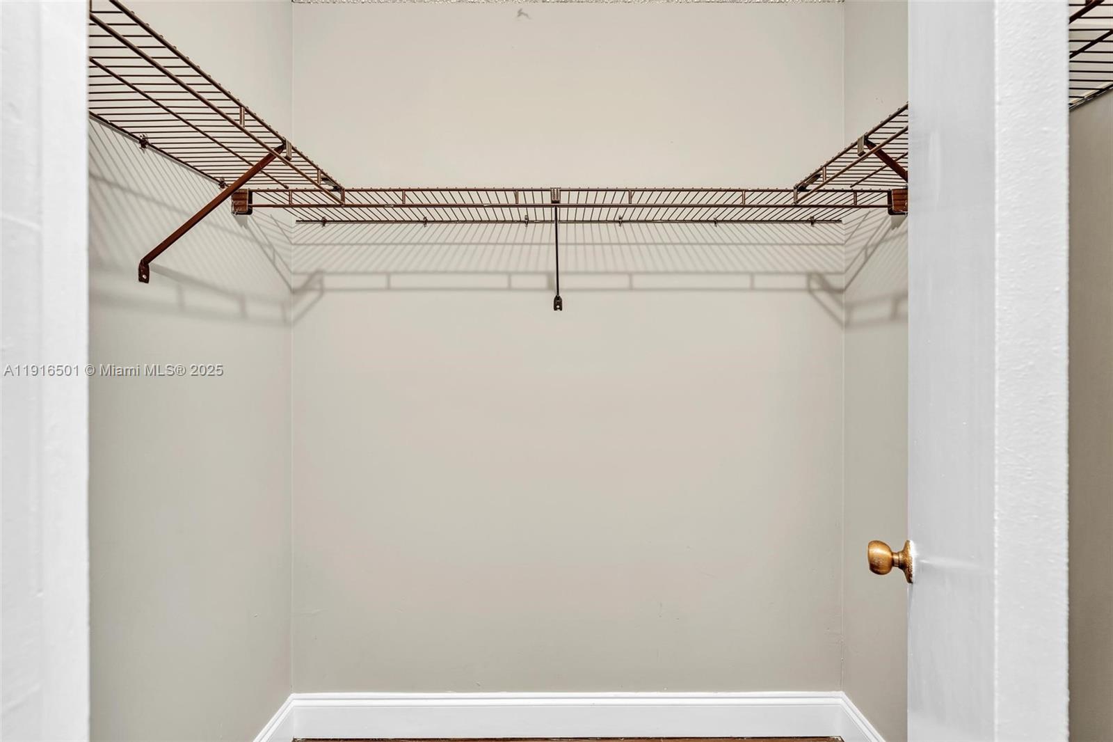 2701 Riverside Drive, Unit 303B Coral Springs, FL 33065 - Photo 8 of 19 a view of a room with racks on the wall