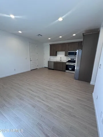 a view of a kitchen with stove and cabinets