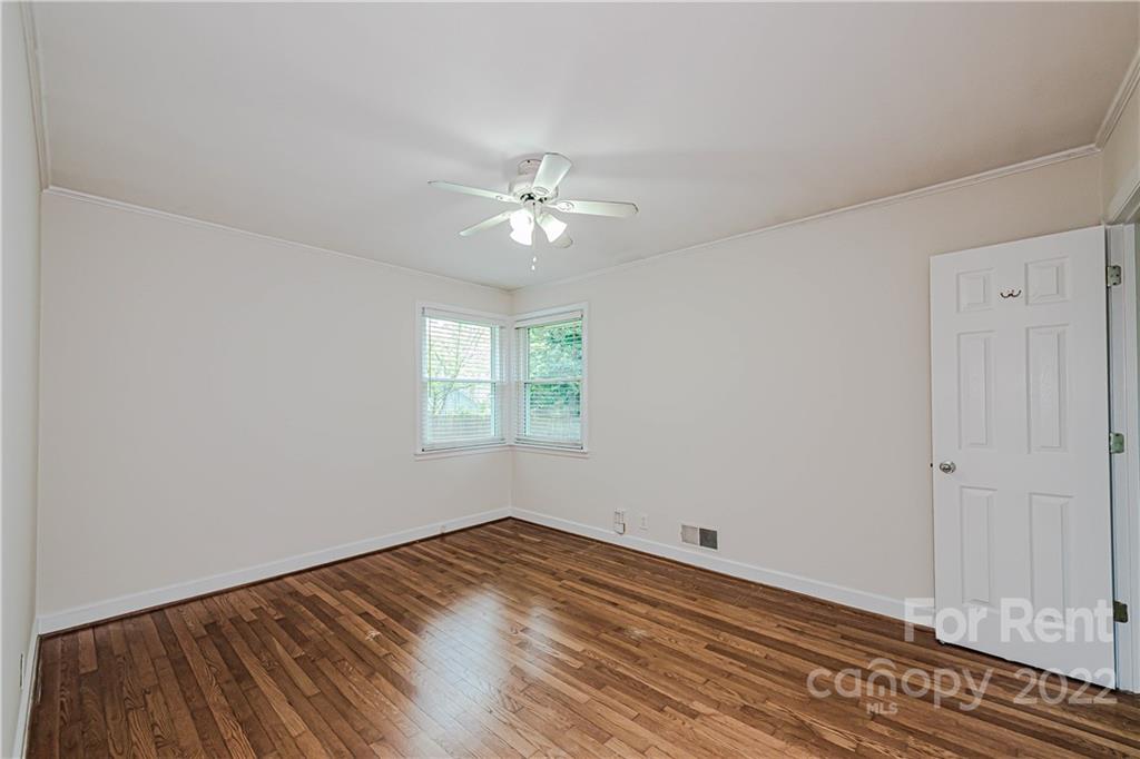 4301 Applegate Road Charlotte, NC 28209 - Photo 12 of 21 a view of a room with wooden floor and a ceiling fan