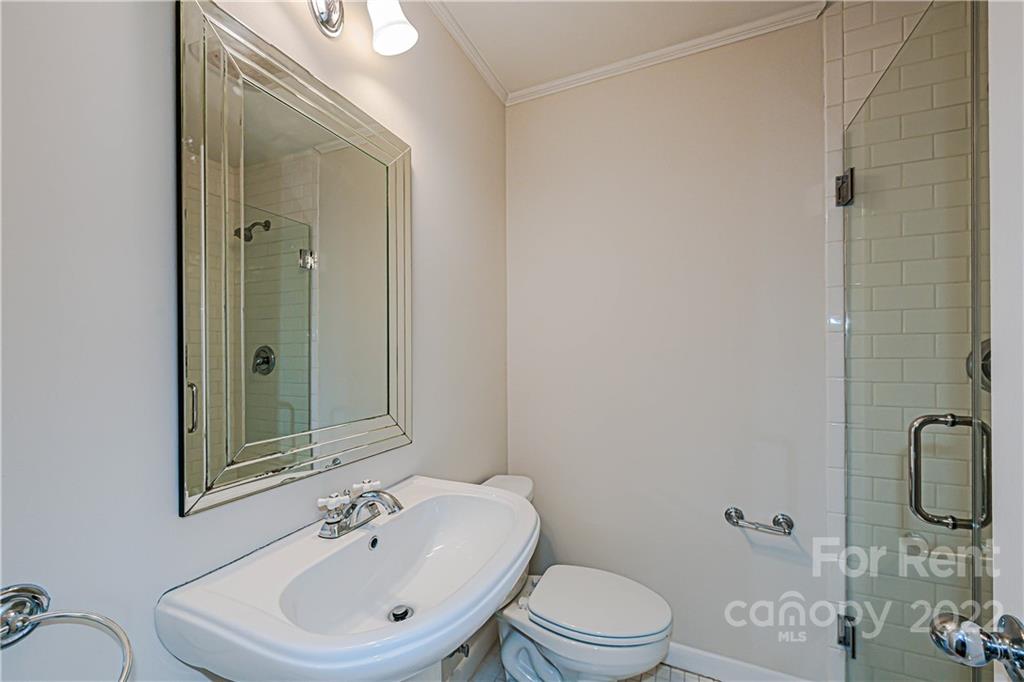4301 Applegate Road Charlotte, NC 28209 - Photo 16 of 21 a bathroom with a sink a toilet and shower