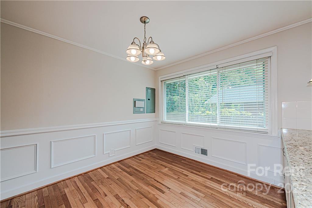 4301 Applegate Road Charlotte, NC 28209 - Photo 10 of 21 a view of an empty room with wooden floor and a window