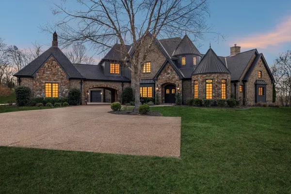 a front view of a house with a yard