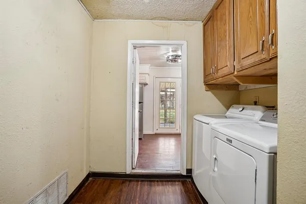 a view of storage and utility room with washer and dryer