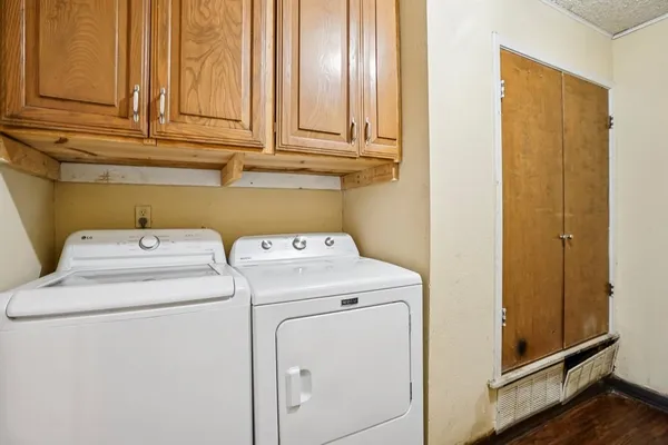 a view of storage and utility room with washer and dryer