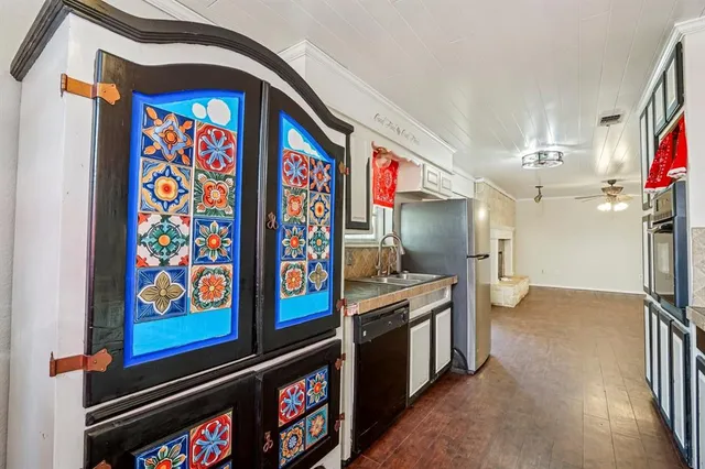 a view of an entryway with wooden floor