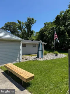 a view of backyard with a garden and entertaining space