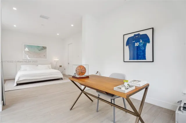 a bedroom with furniture and a table