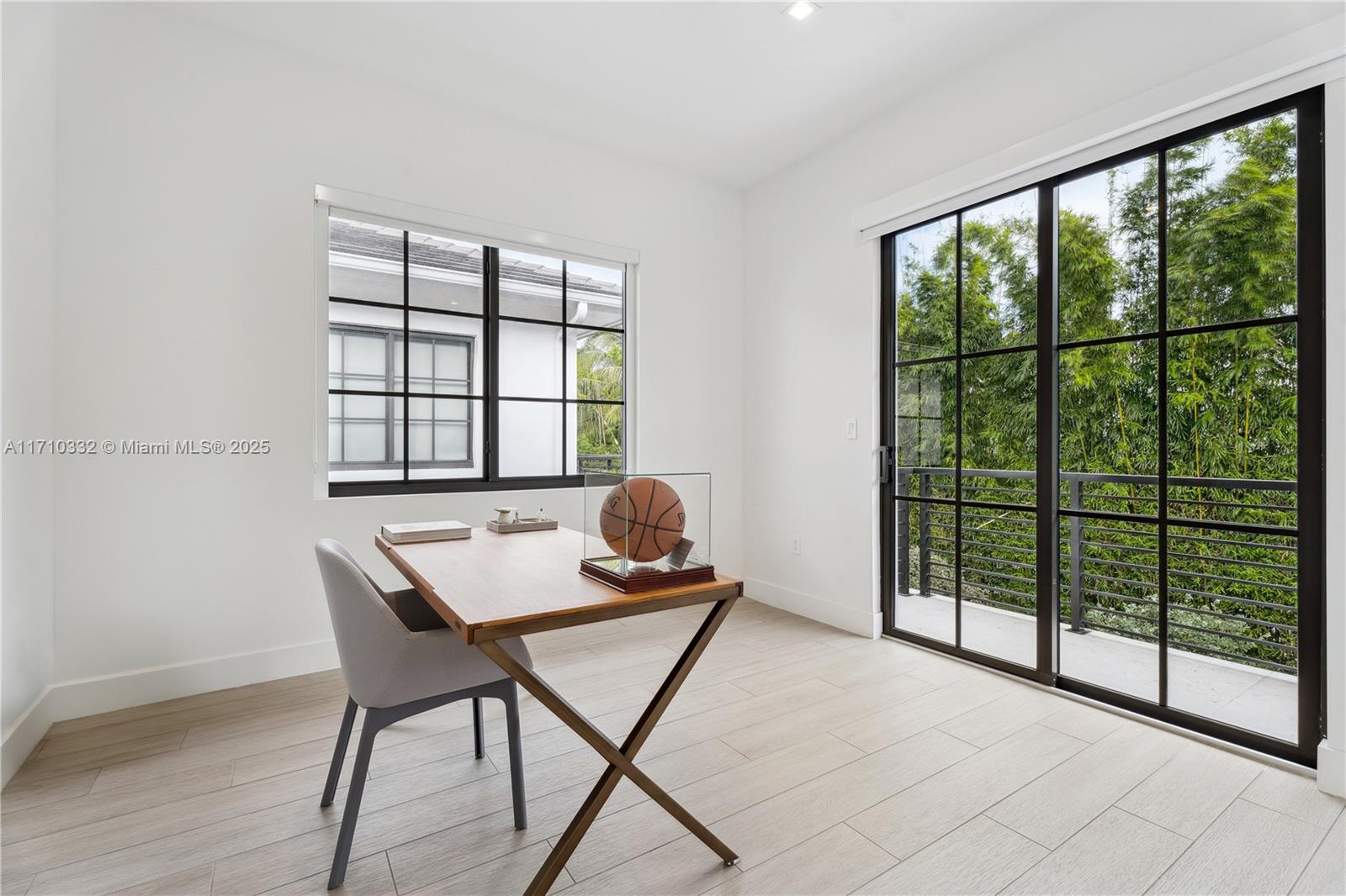 8391 Southwest 65th Avenue, Unit 8391 Miami, FL 33143 - Photo 12 of 24 a workspace with furniture and window