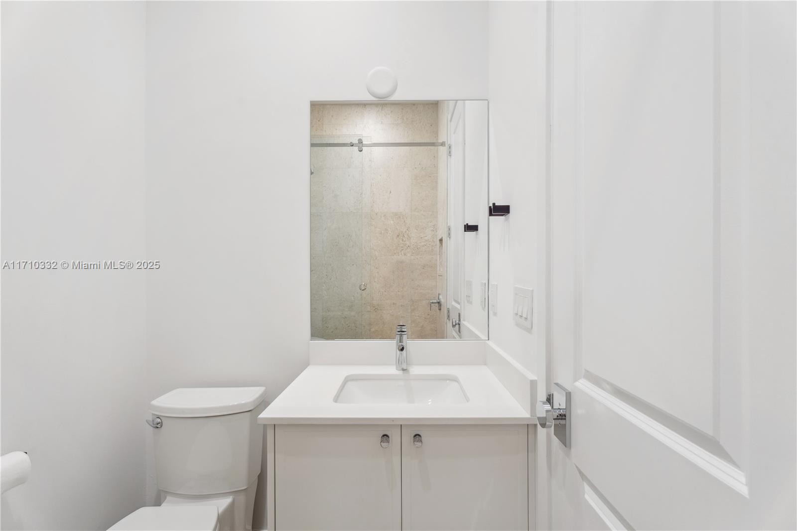 8391 Southwest 65th Avenue, Unit 8391 Miami, FL 33143 - Photo 17 of 24 a bathroom with a sink a toilet and shower