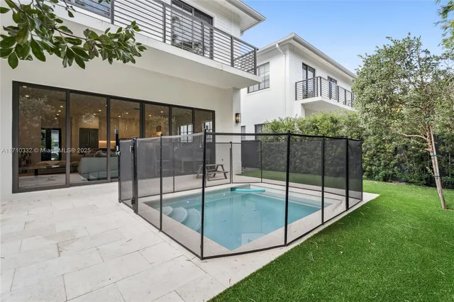 a view of a house with backyard and porch