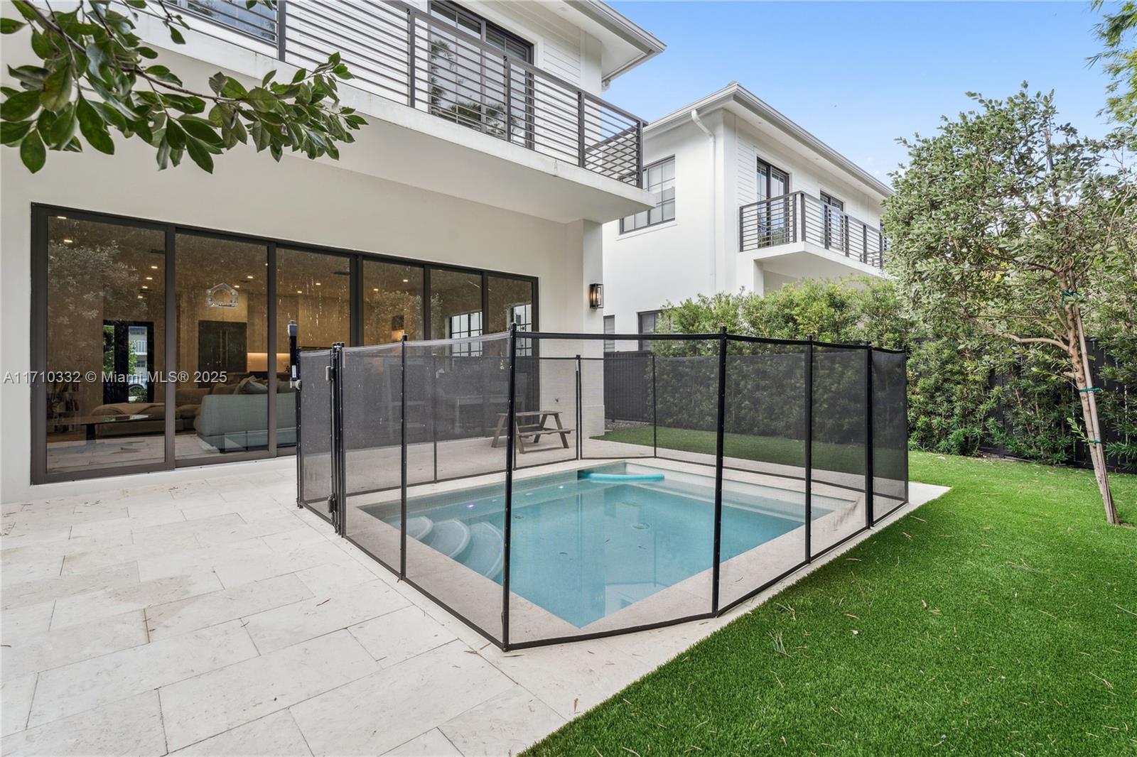 8391 Southwest 65th Avenue, Unit 8391 Miami, FL 33143 - Photo 3 of 24 a view of a house with backyard and porch