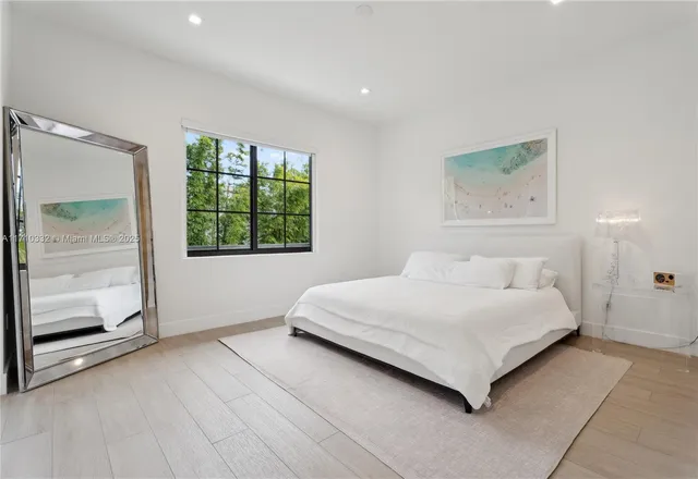 a room with a bed and a window