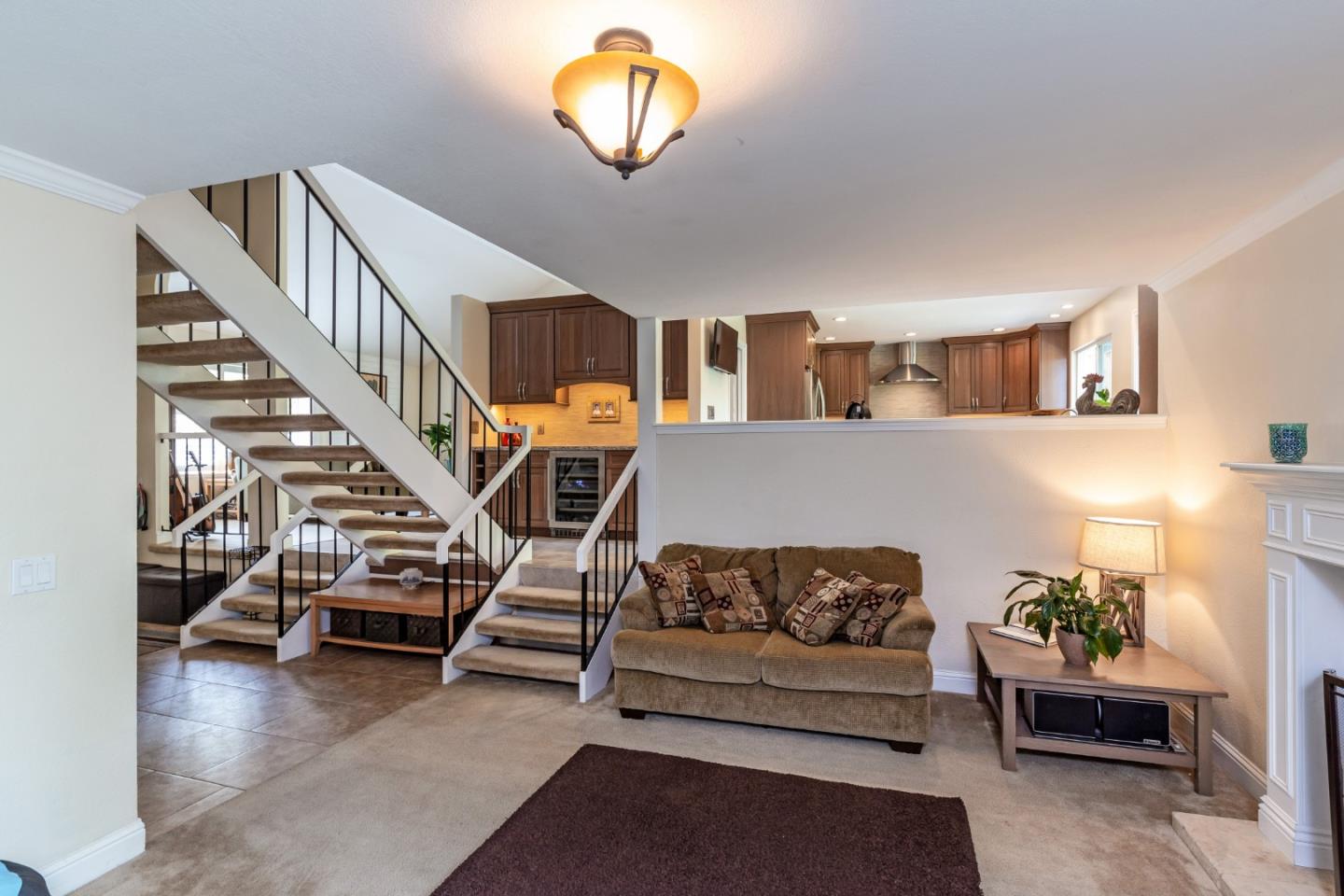 6593 Springpath Lane San Jose, CA 95120 - Photo 12 of 40 a living room with furniture and a chandelier