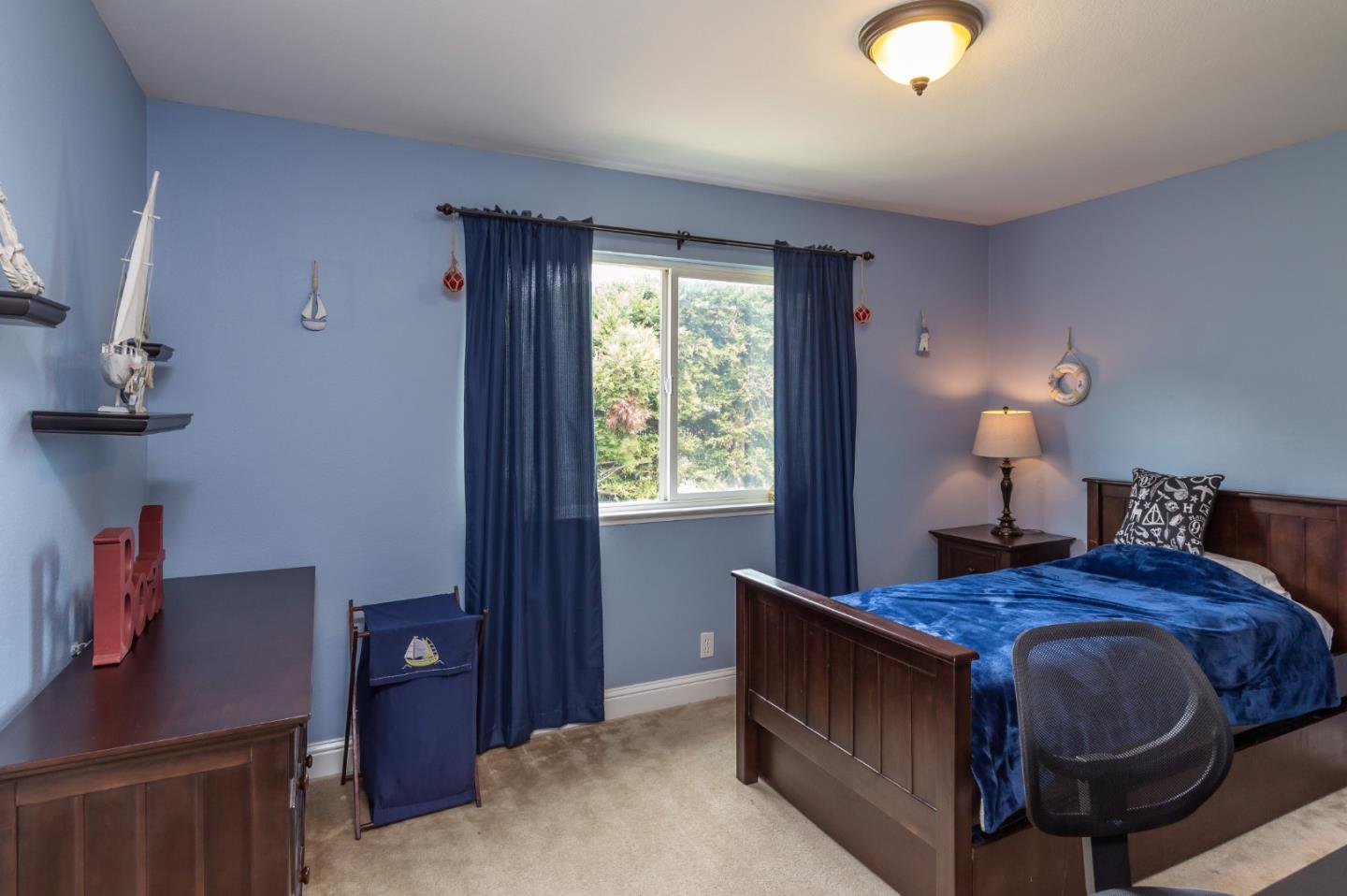 6593 Springpath Lane San Jose, CA 95120 - Photo 16 of 40 a bed room with a bed and a desk