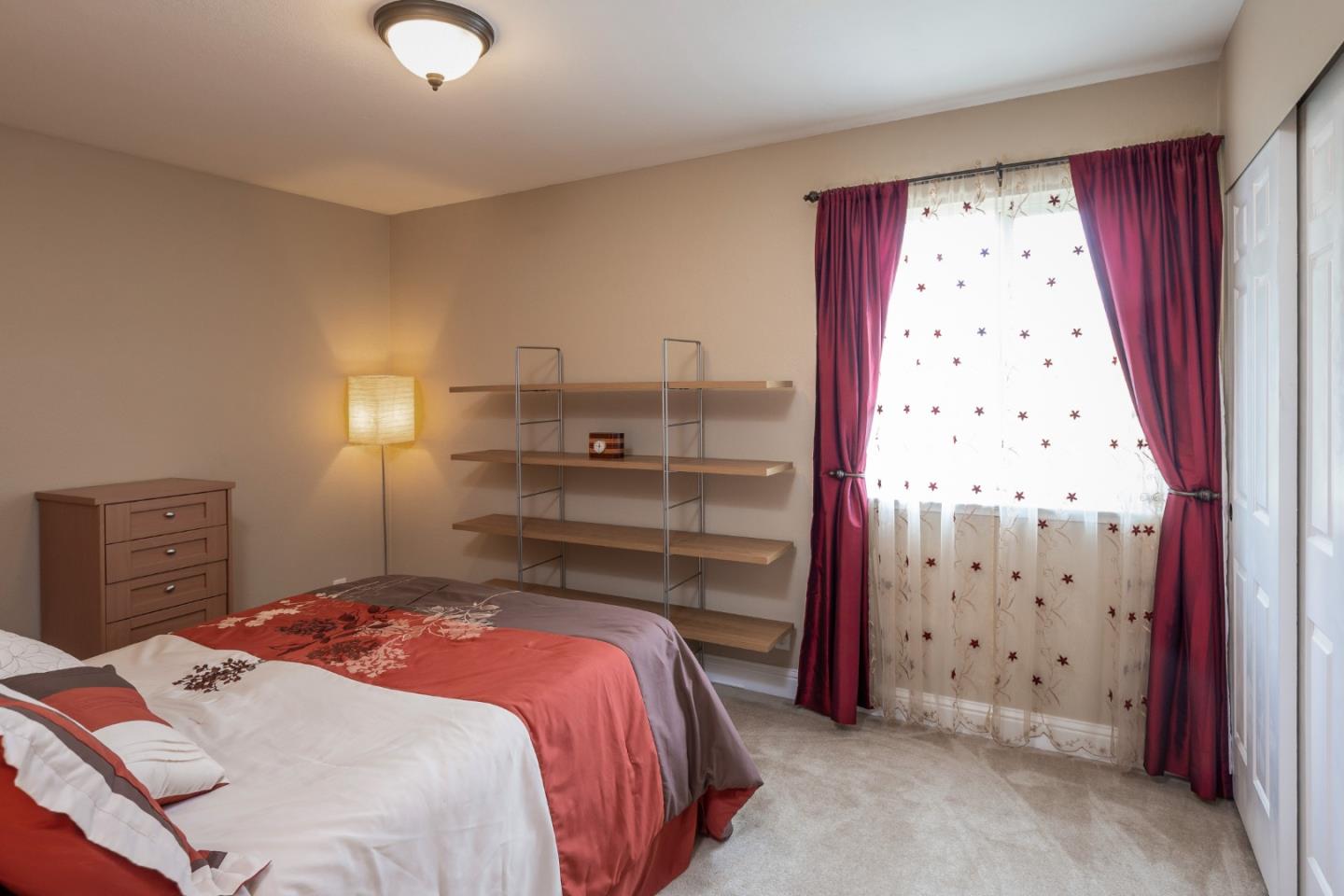 6593 Springpath Lane San Jose, CA 95120 - Photo 17 of 40 a bedroom with a bed and a window