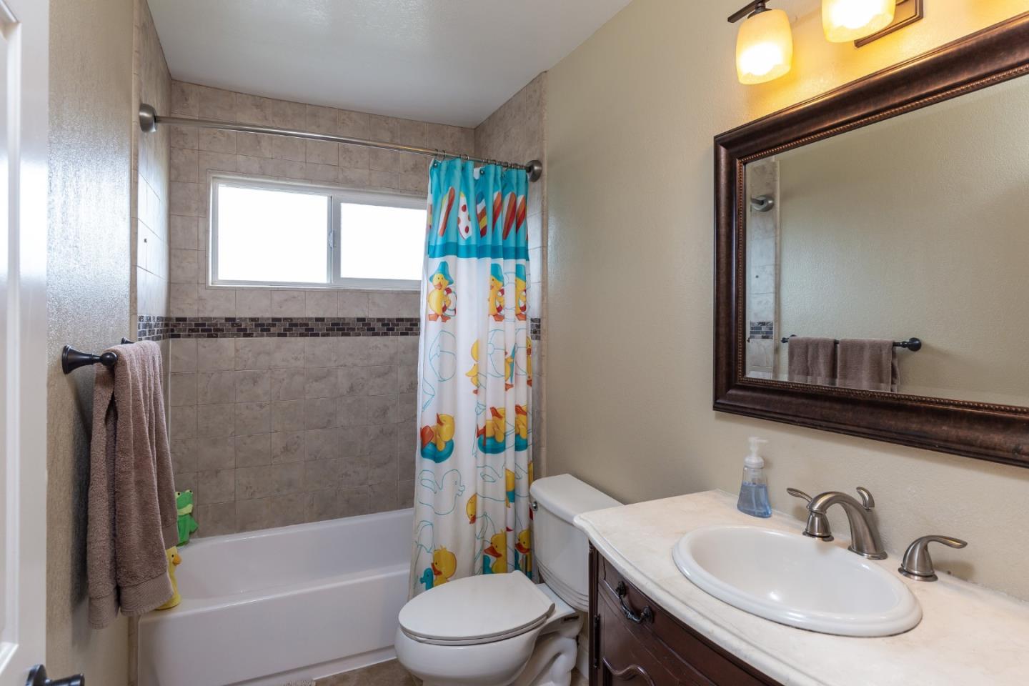 6593 Springpath Lane San Jose, CA 95120 - Photo 19 of 40 a bathroom with a sink toilet and shower