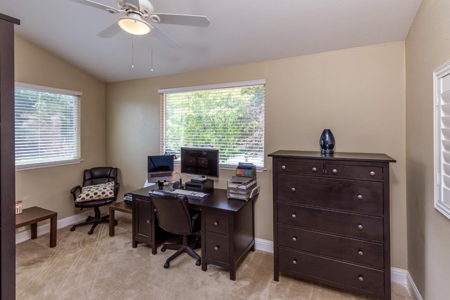 6593 Springpath Lane San Jose, CA 95120 - Photo 22 of 40 a view of a workspace with furniture and a window