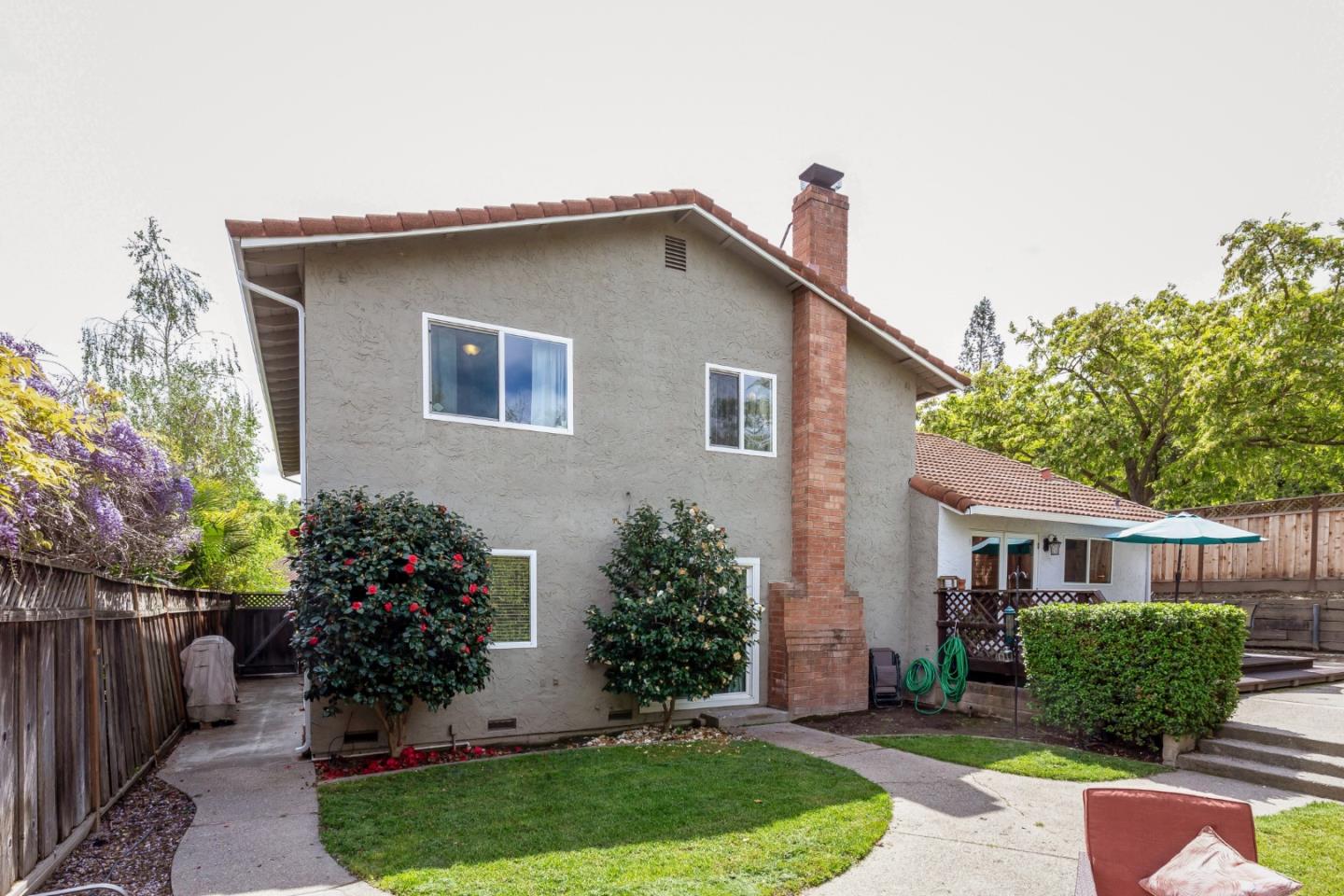 6593 Springpath Lane San Jose, CA 95120 - Photo 27 of 40 a front view of a house with a yard