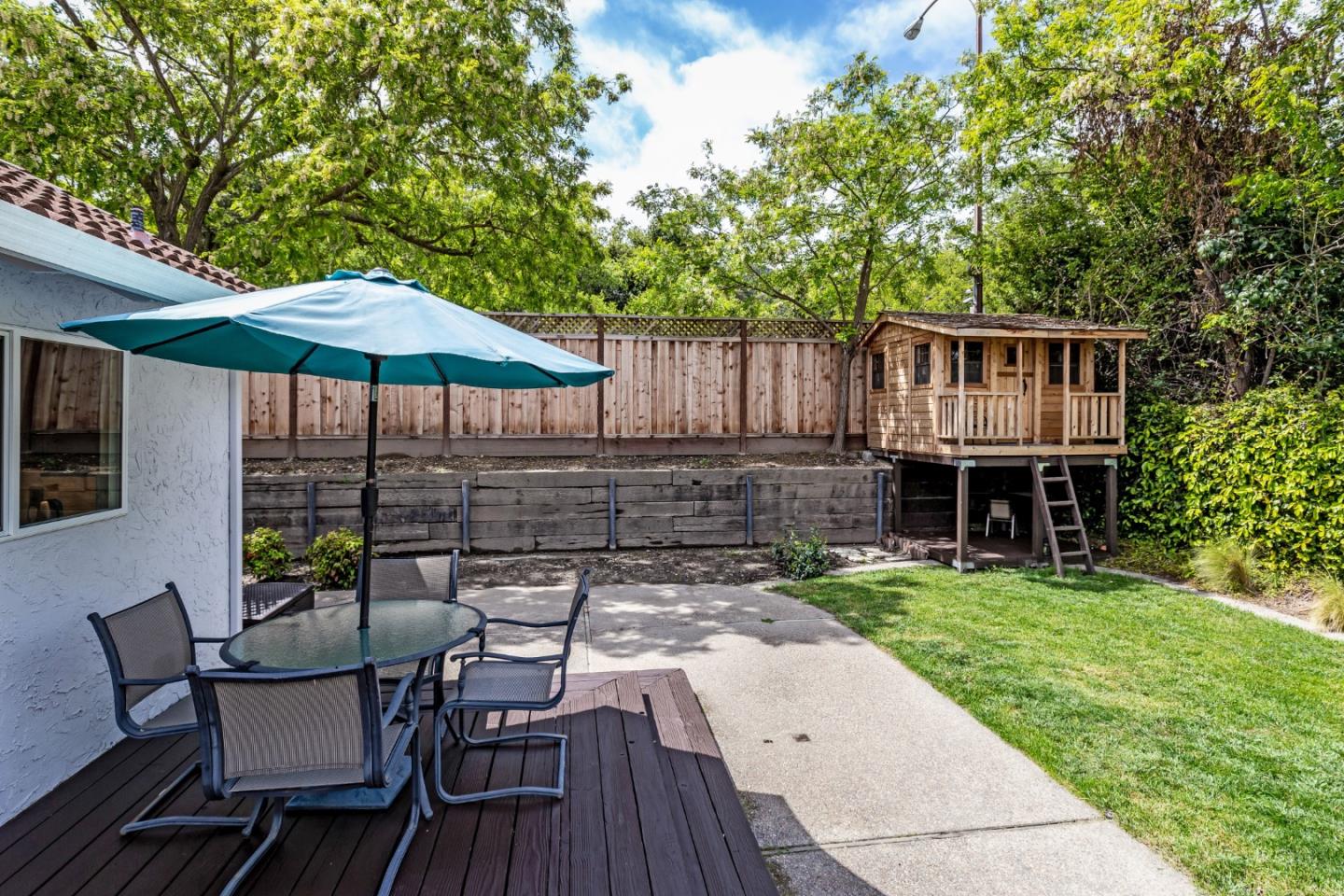 6593 Springpath Lane San Jose, CA 95120 - Photo 28 of 40 a view of a chair and table on the wooden deck