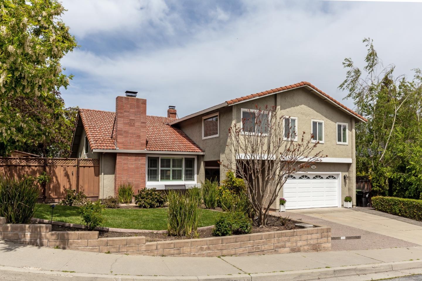 6593 Springpath Lane San Jose, CA 95120 - Photo 3 of 40 a front view of a house with garden