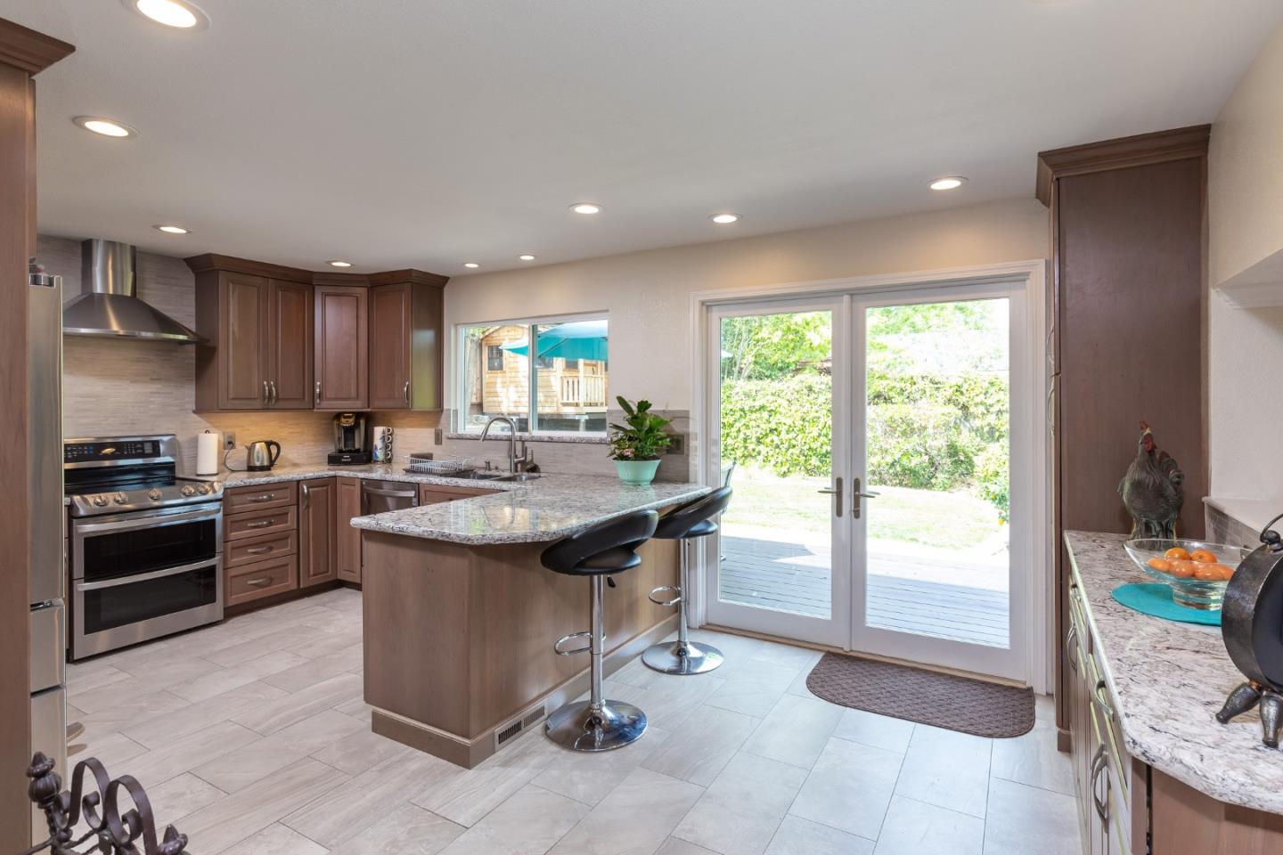 6593 Springpath Lane San Jose, CA 95120 - Photo 8 of 40 a kitchen with a stove a sink and a refrigerator