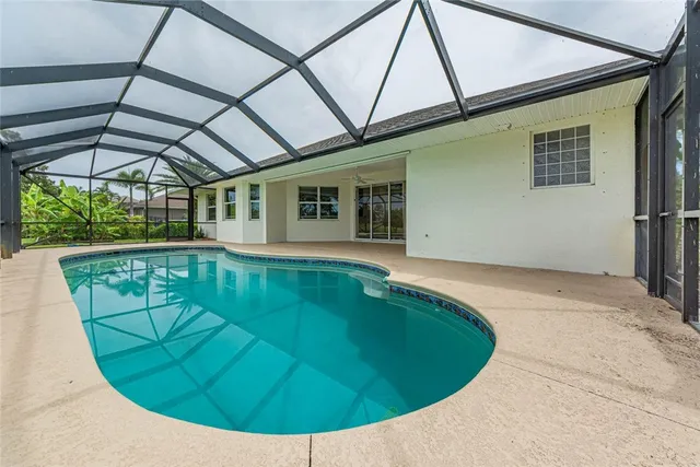 a view of a livingroom with an empty space and a window