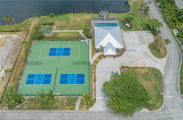 an aerial view of a house with a lake view