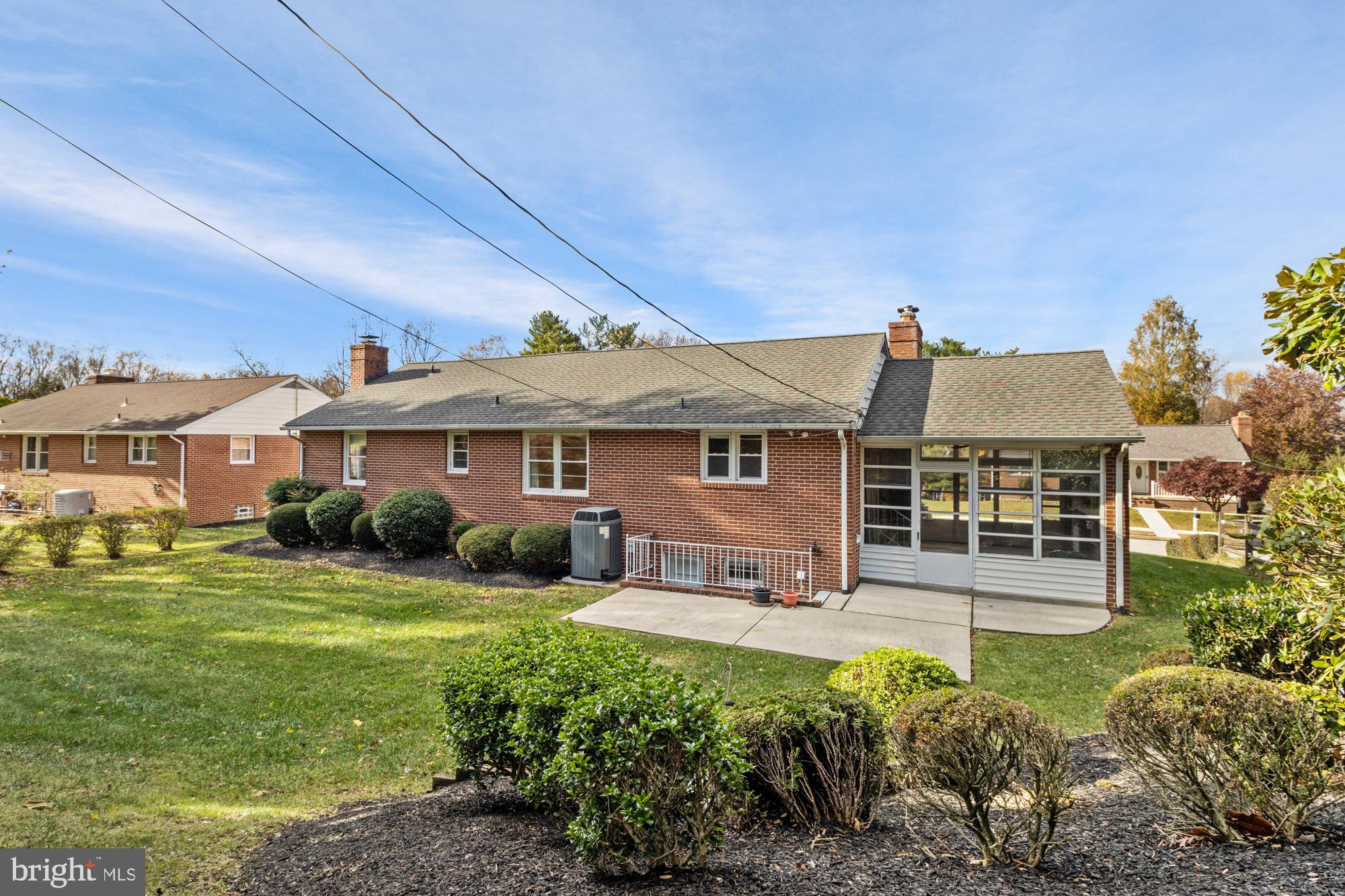 4302 Falls Park Road Perry Hall, MD 21128 - Photo 12 of 54 a front view of a house with a yard