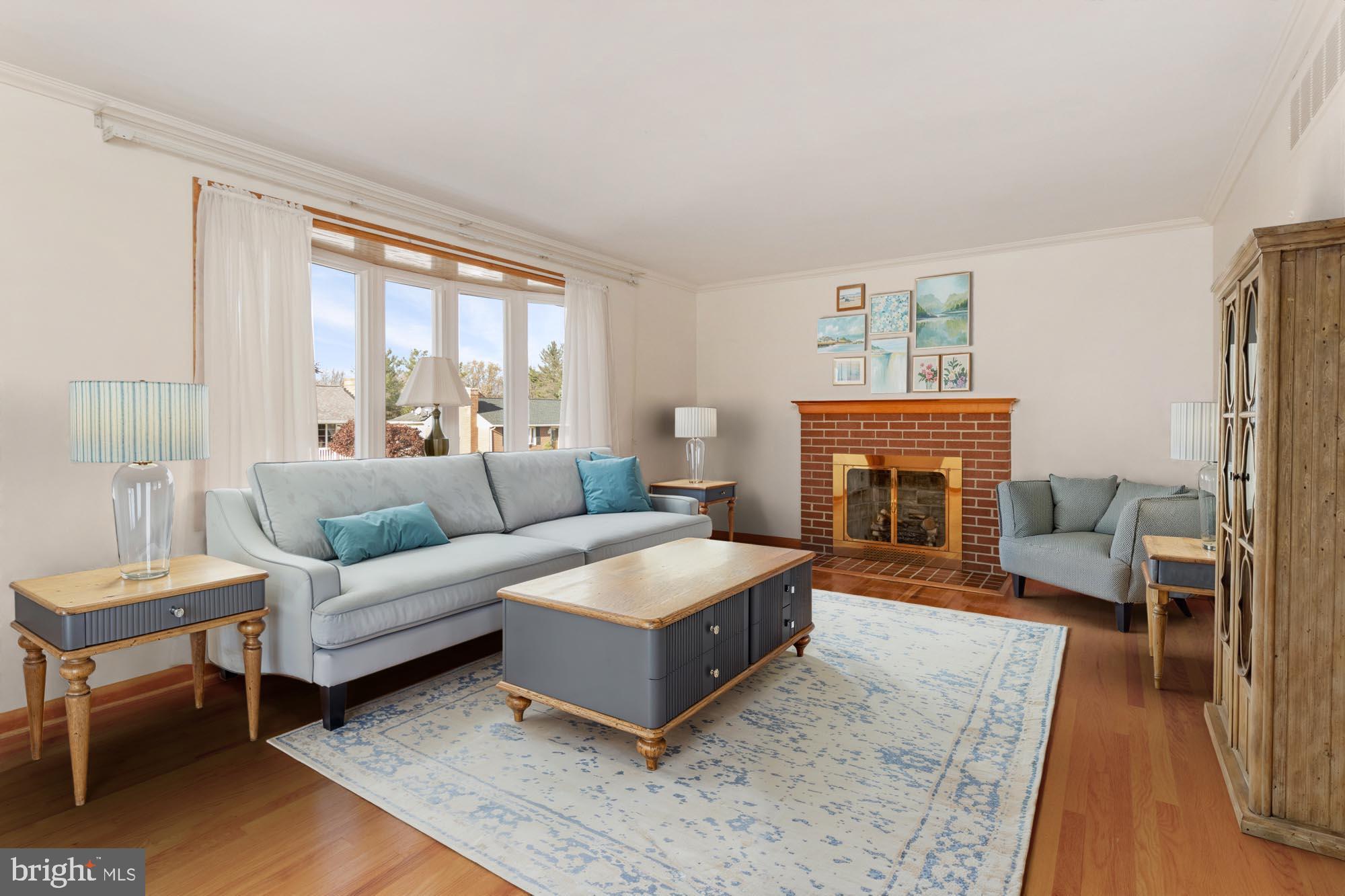 4302 Falls Park Road Perry Hall, MD 21128 - Photo 15 of 54 a living room with furniture a large window and a fireplace