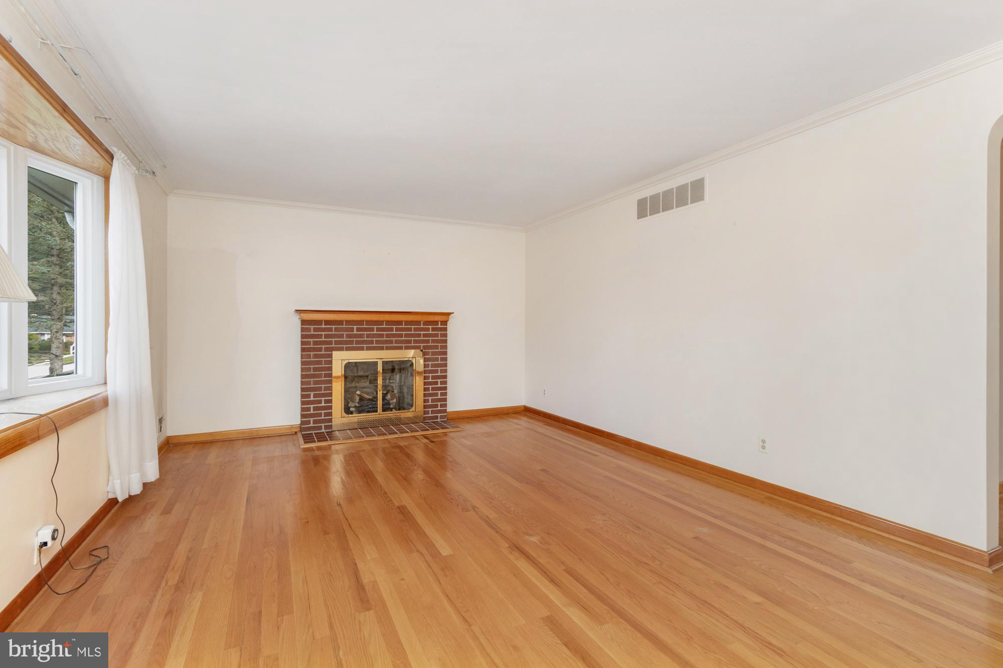 4302 Falls Park Road Perry Hall, MD 21128 - Photo 17 of 54 a view of an empty room with wooden floor and a window