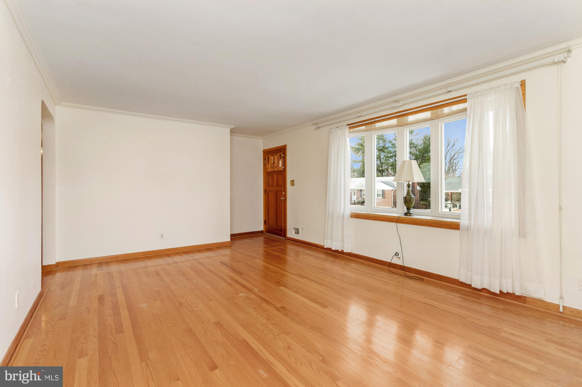 4302 Falls Park Road Perry Hall, MD 21128 - Photo 18 of 54 a view of an empty room with a window and wooden floor