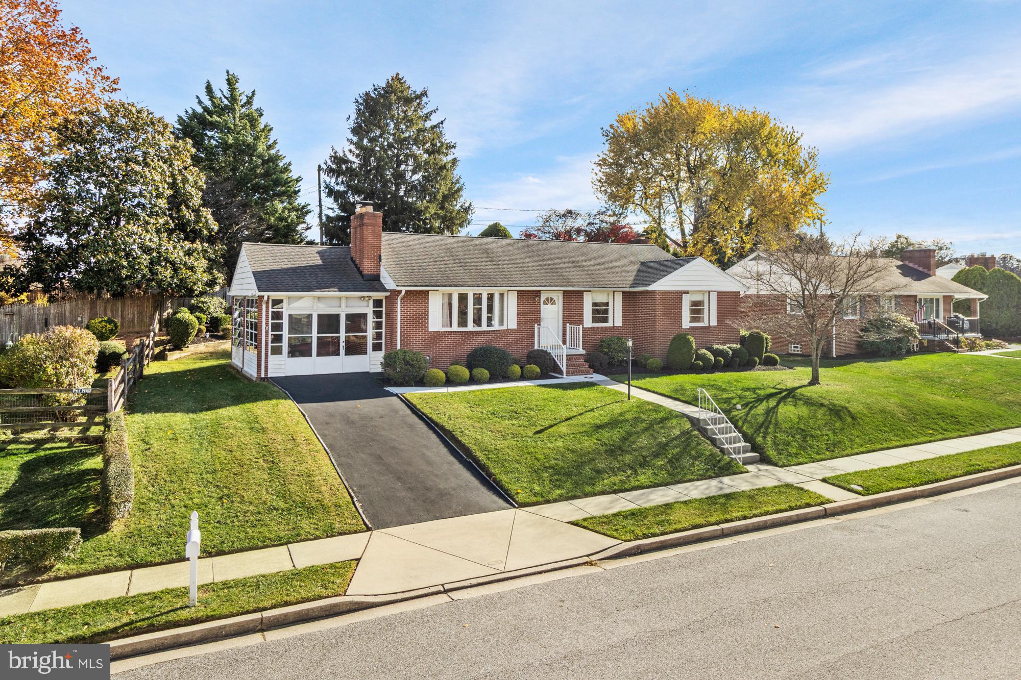 4302 Falls Park Road Perry Hall, MD 21128 - Photo 2 of 54 a front view of a house with a yard and potted plants