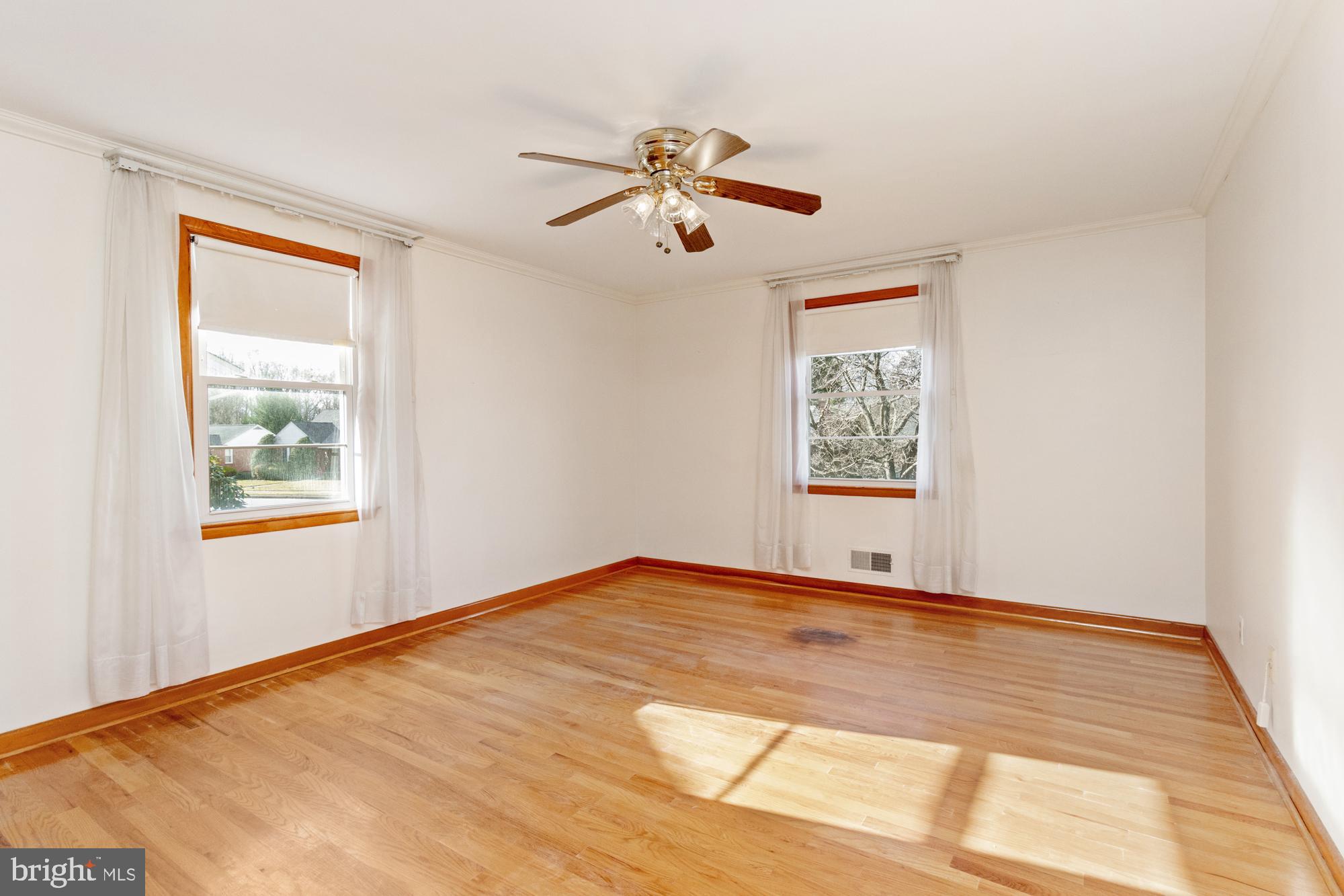 4302 Falls Park Road Perry Hall, MD 21128 - Photo 25 of 54 a view of an empty room with wooden floor and a window