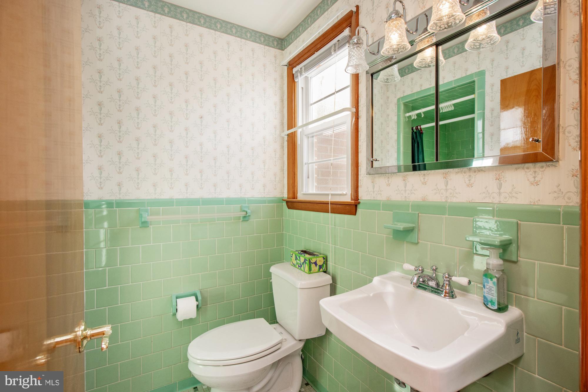 4302 Falls Park Road Perry Hall, MD 21128 - Photo 29 of 54 a bathroom with a sink a toilet and mirror