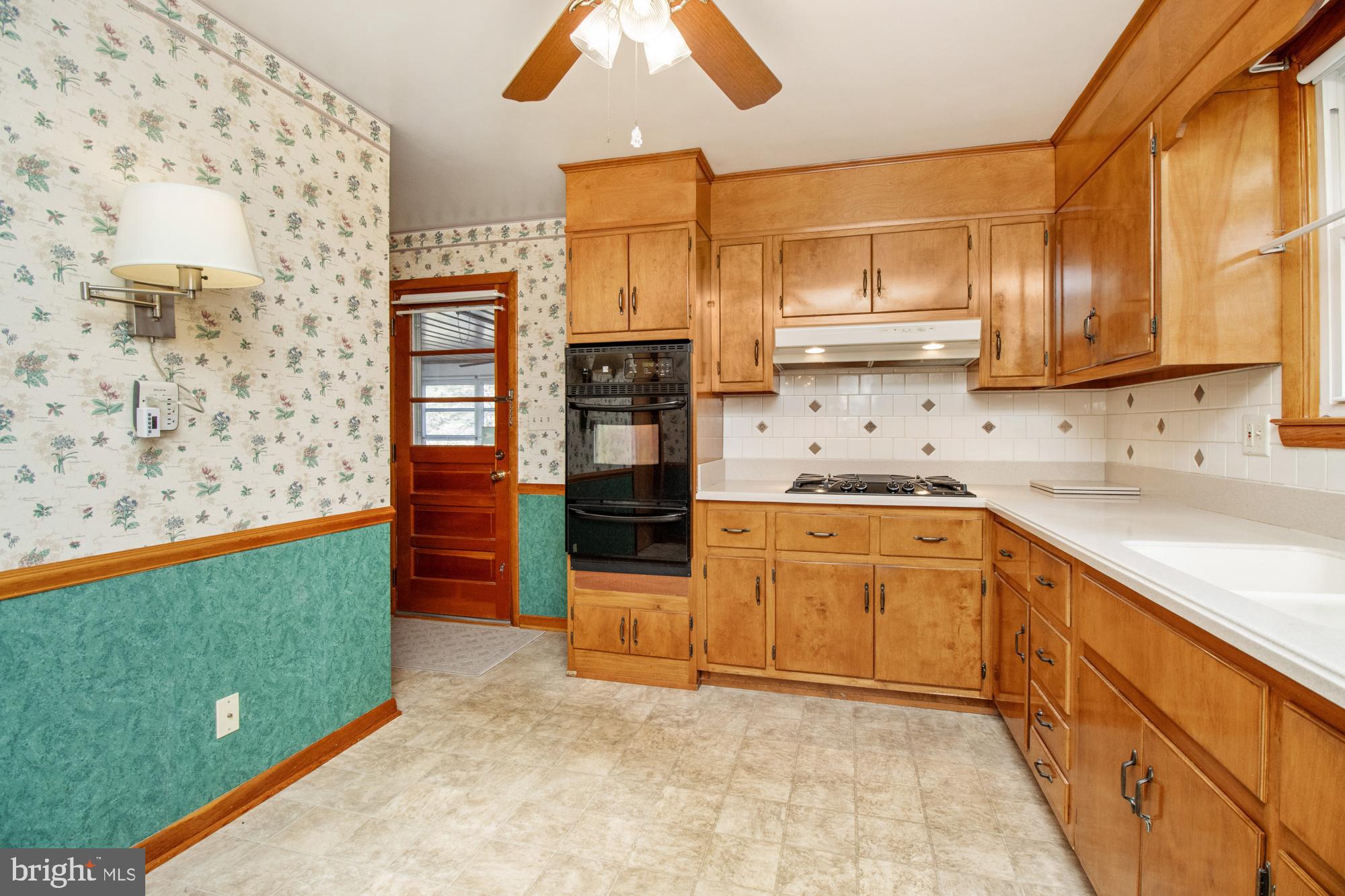 4302 Falls Park Road Perry Hall, MD 21128 - Photo 35 of 54 a kitchen with stainless steel appliances granite countertop a stove a sink and a refrigerator