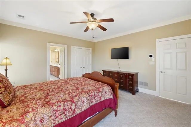 a bathroom with a double vanity sink a mirror and a shower