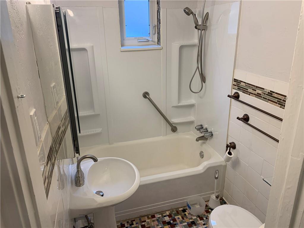 5450 Covode Place, Unit 2 Pittsburgh, PA 15217 - Photo 11 of 16 a bathroom with a sink a toilet and a bathtub
