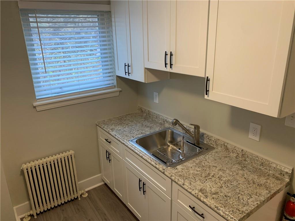5450 Covode Place, Unit 2 Pittsburgh, PA 15217 - Photo 13 of 16 a kitchen with a sink and cabinets