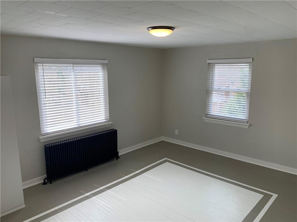 5450 Covode Place, Unit 2 Pittsburgh, PA 15217 - Photo 7 of 16 a room that has a window and a wooden floor