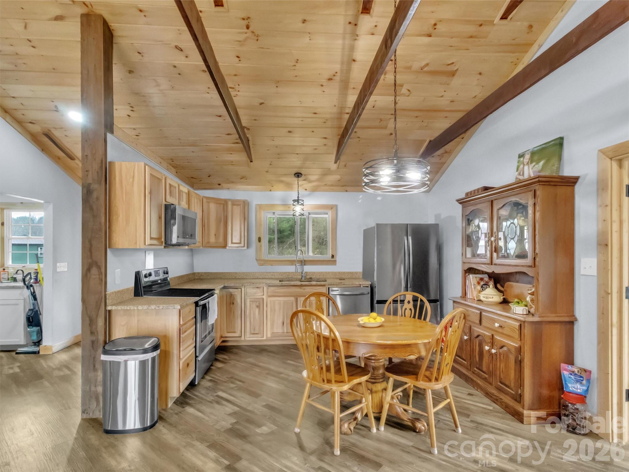 522 North River Road Sylva, NC 28779 - Photo 7 of 39 a view of a dining room with furniture and wooden floor