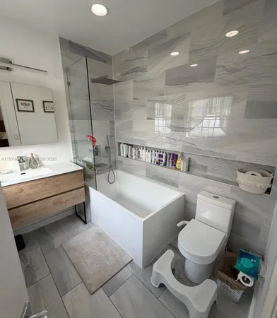 a bathroom with a toilet a sink and a bathtub