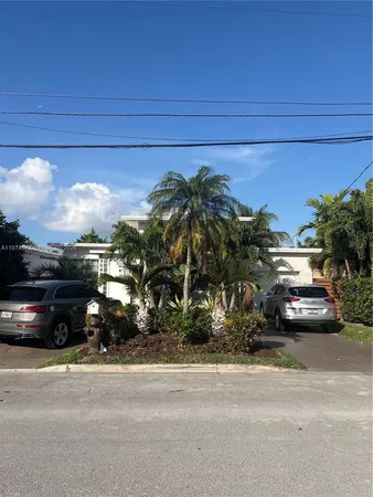 a view of street with parked cars