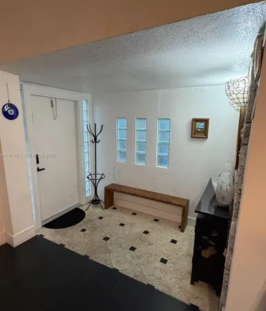 a bedroom with a bed and a mirror