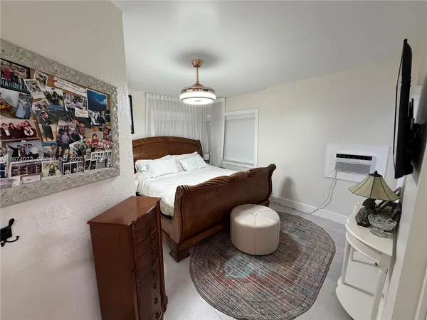 a living room with furniture and a mirror