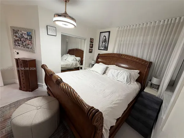 a bedroom with bed and window